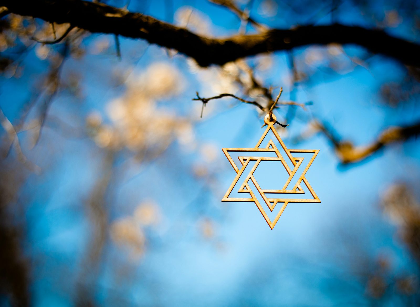 A Star of David in warm light, representing culturally informed therapy for Jewish men, online across Ontario.